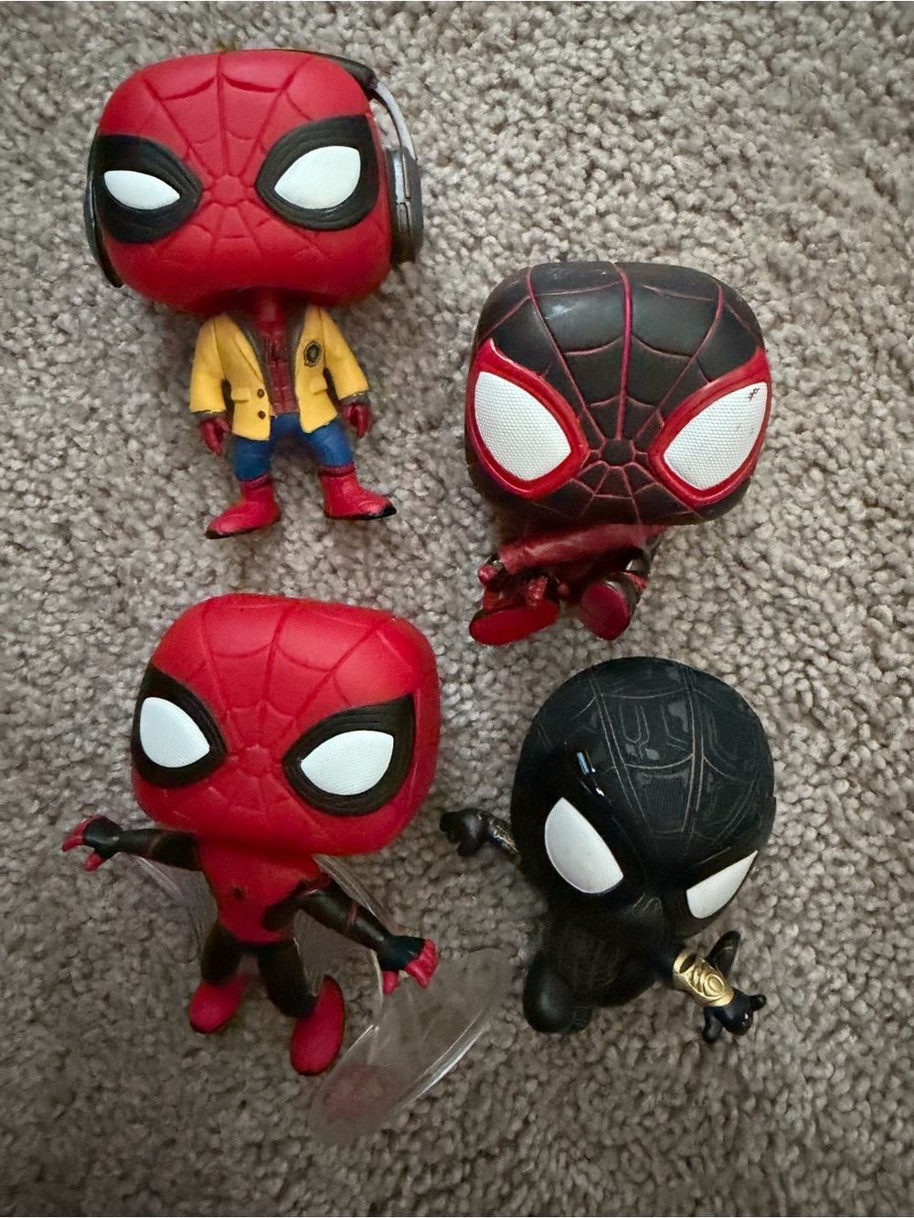 Funko Spider-Man Collectible Figures in Red, Black, and Yellow